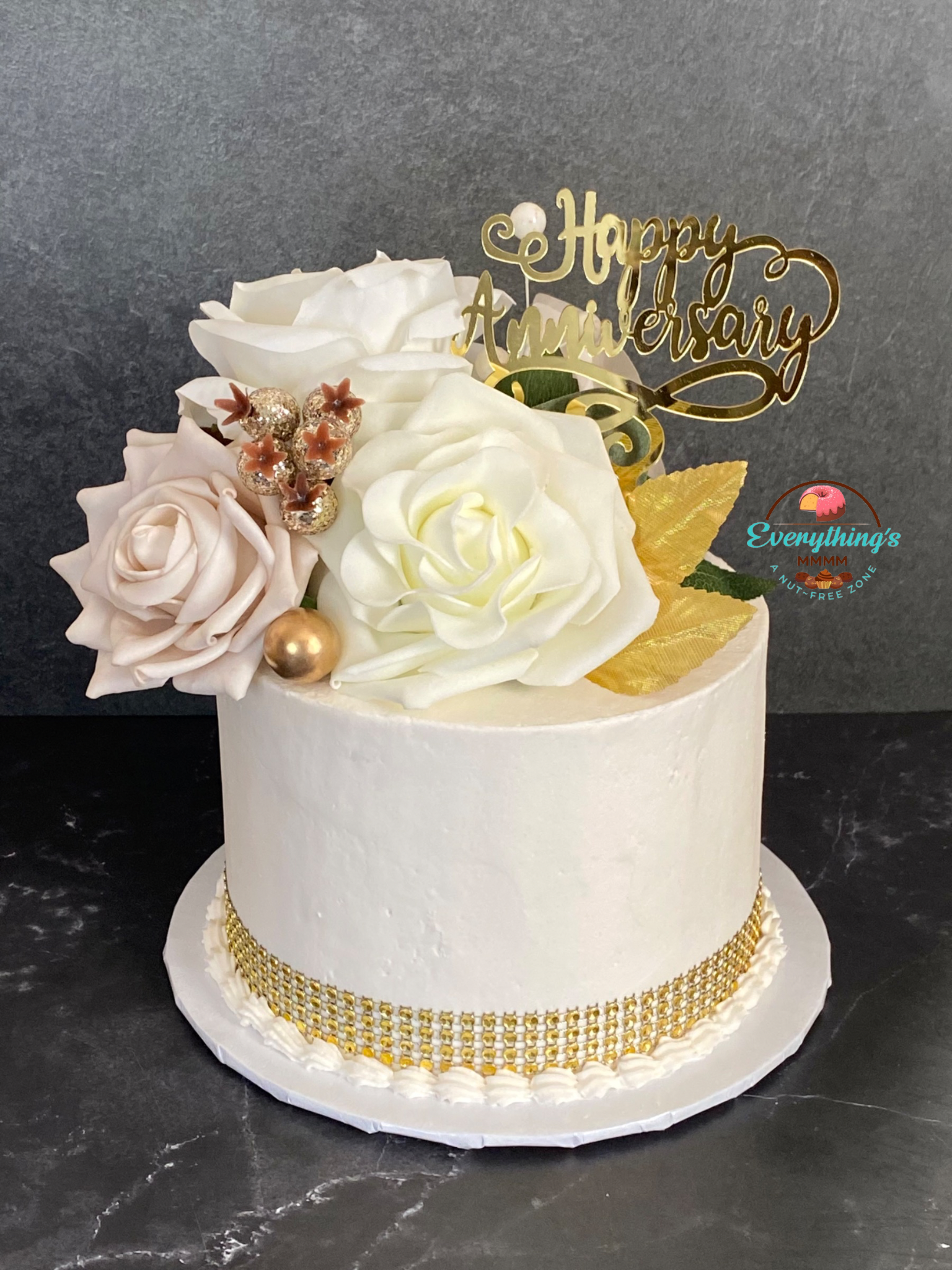 Floral Elegant anniversary cake. Gold, white